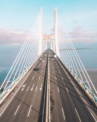 Low angle view of suspension bridge against sky