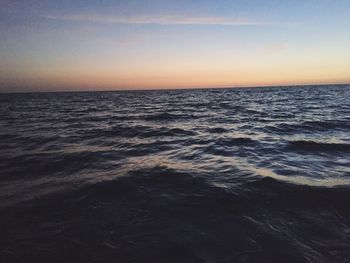 Scenic view of sea against sky at sunset