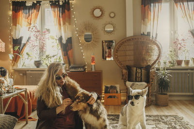 Woman dressing up dogs