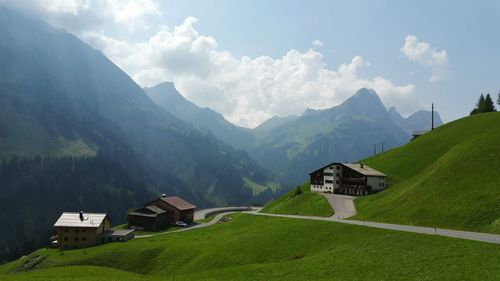 Scenic view of mountains against cloudy sky