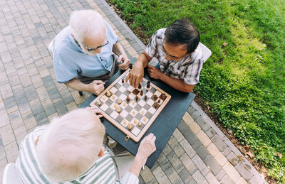 High angle view of people relaxing on floor