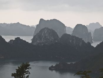 Rock formations on sea in foggy weather