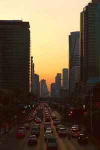 View of traffic on road at sunset