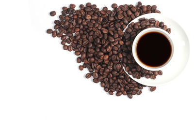 High angle view of coffee cup over white background