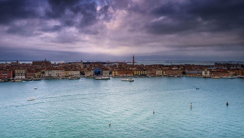 Panoramic view of sea and buildings against sky