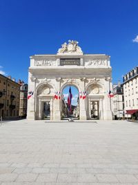 Facade of historic building against blue sky