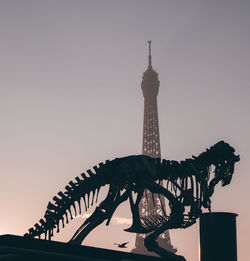 Low angle view of statue against building