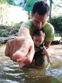 Father and daughter in water
