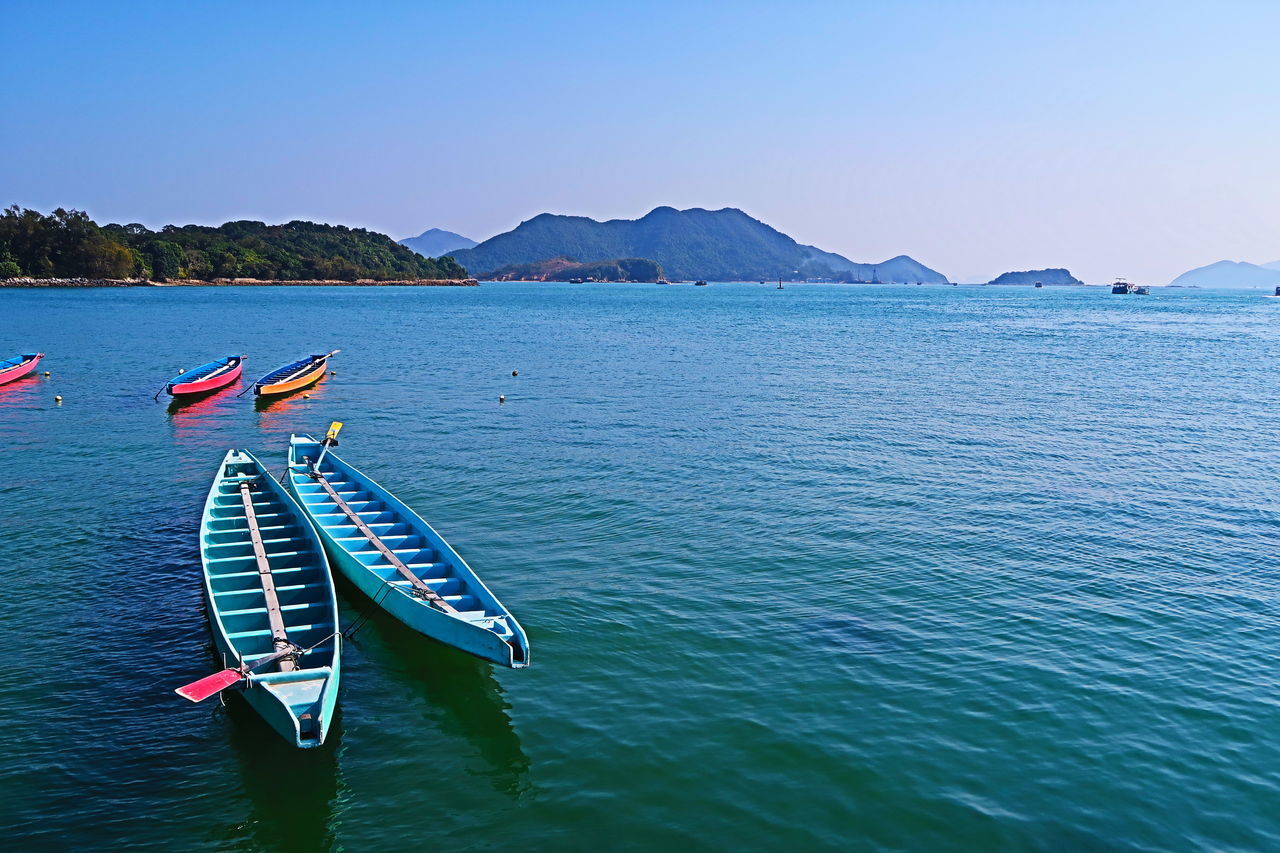 BOAT IN SEA AGAINST CLEAR SKY