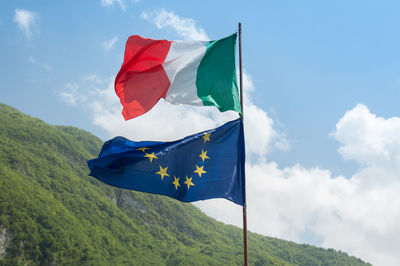 Low angle view of flag against sky