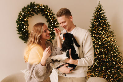 Portrait of smiling couple sitting at home