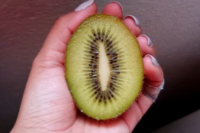 Close-up of hand holding apple