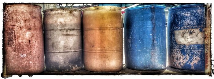 Close-up of blue jar on wood
