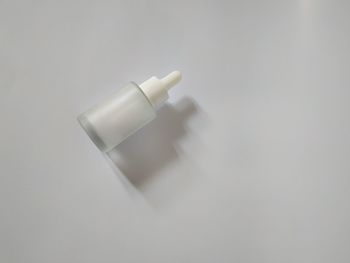 High angle view of lamp on table against white background