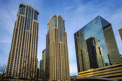 Low angle view of skyscrapers against sky