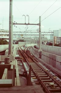 Train on railroad track against sky