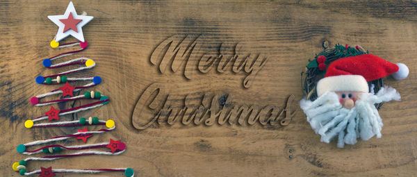 Directly above shot of christmas decorations on wooden table