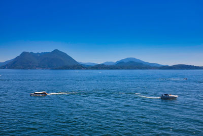 Scenic view of sea against blue sky