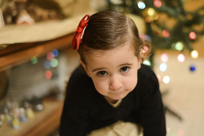 High angle portrait of cute girl at home during christmas