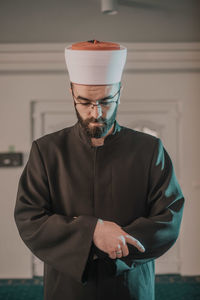 Midsection of man holding ice cream