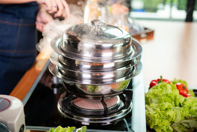 Midsection of man preparing food