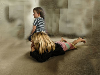 Siblings standing in corridor