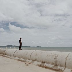 Full length of woman standing against clear sky
