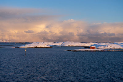 Scenic view of sea against sky during winter