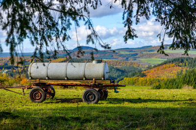 Tractor on field against sky