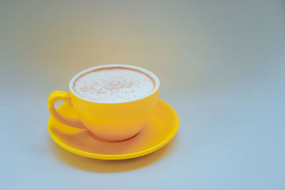 Close-up of coffee cup on table