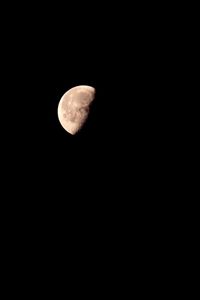 Low angle view of moon against sky at night