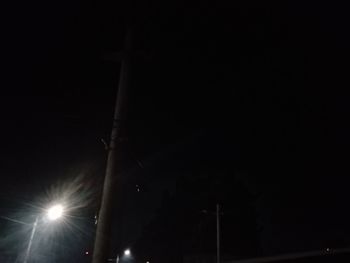 Low angle view of street light at night