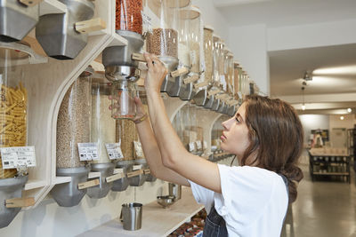 Young woman shopping in packaging-free supermarket