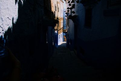 Narrow alley amidst buildings in city