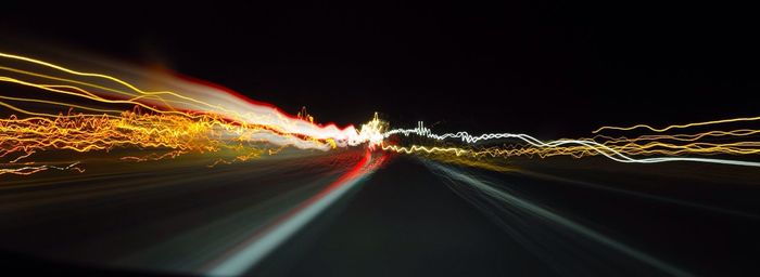 Light trails on road at night