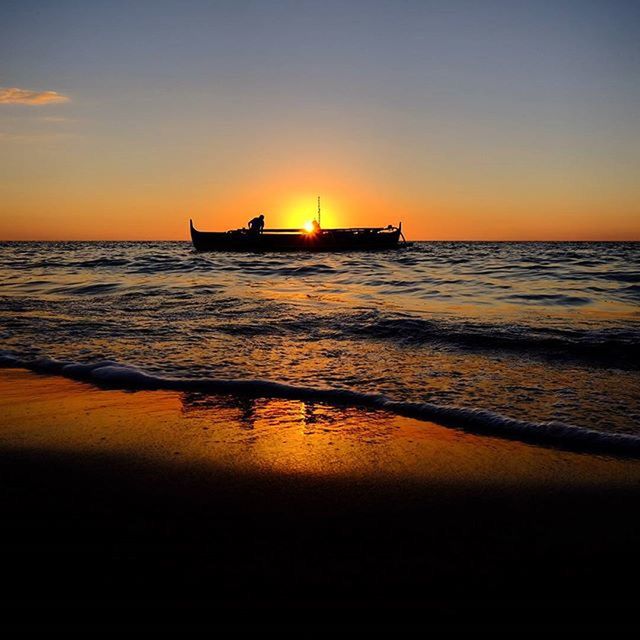 sunset, sea, water, horizon over water, nautical vessel, orange color, transportation, boat, beach, mode of transport, scenics, tranquil scene, beauty in nature, sun, tranquility, sky, shore, nature, reflection, idyllic