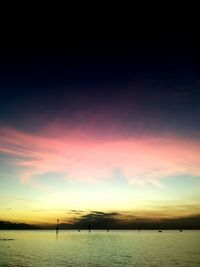 Scenic view of calm lake at sunset