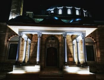 Low angle view of illuminated statue at night