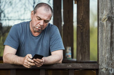 Man using mobile phone outdoors