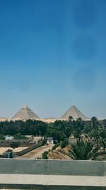 Scenic view of mountains against clear blue sky