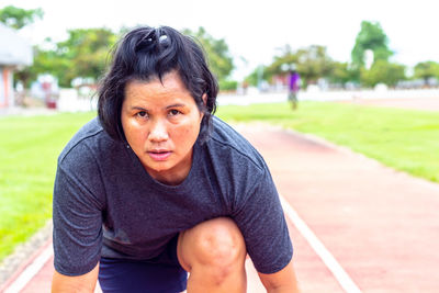 Portrait of mature woman on sports track