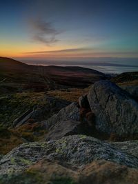 Scenic view of sea against sky at sunset