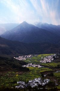 Scenic view of landscape and mountains against sky