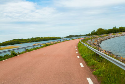 Empty road along landscape