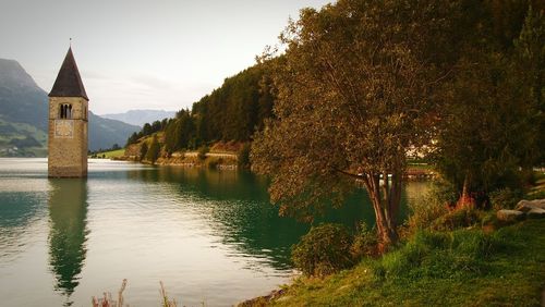 Church in lake reschen against sky