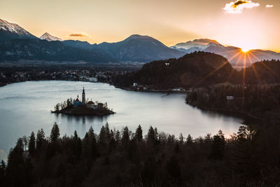 Scenic view of lake against sky during sunset