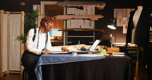 Young woman using laptop at home