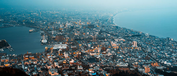 High angle view of illuminated buildings in city