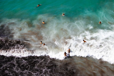 High angle view of people on sea shore