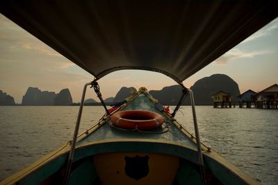 Boat sailing in sea against sky